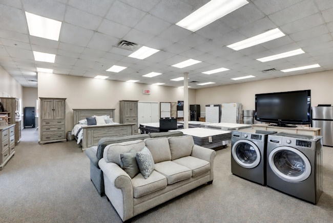 Rent-to-own furniture, appliances, electronics, and mattresses in a showroom setting