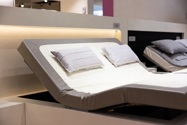 Adjustable smart bed display for shoppers comparing premium mattress options