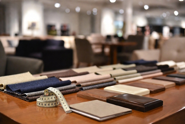 Measuring tape and fabric samples used to compare affordable furniture options