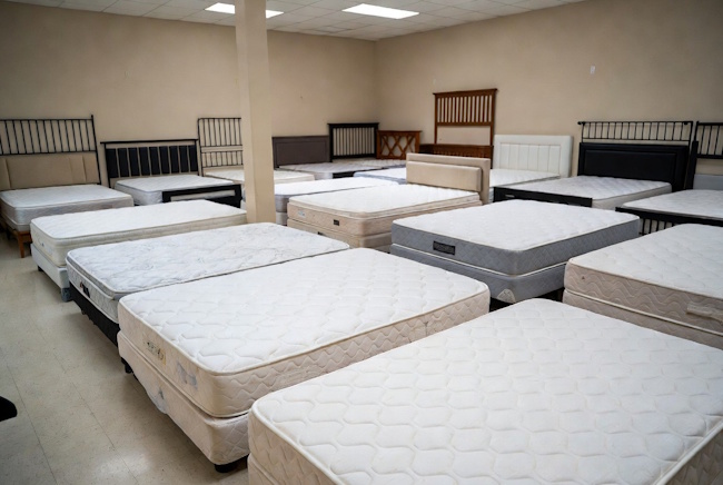 Affordable mattresses and bed frames in a Baton Rouge furniture showroom