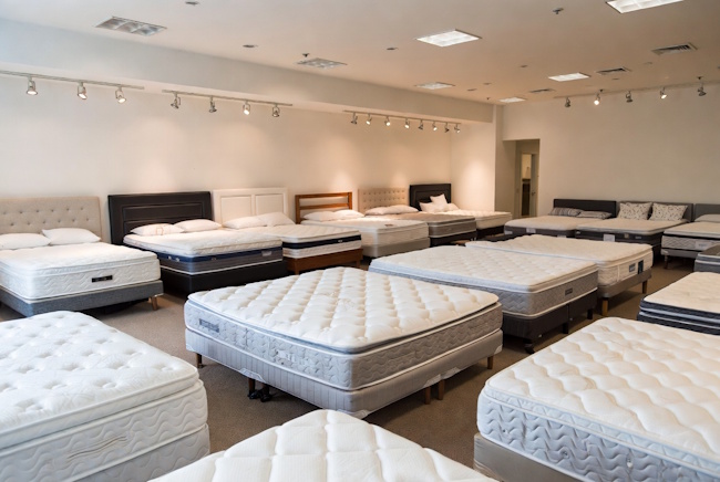 Mattress showroom with memory foam, hybrid, and innerspring beds for Baton Rouge shoppers