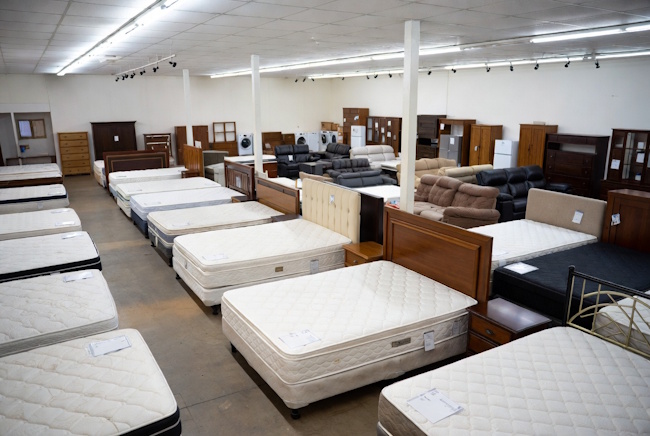 Discount furniture and mattress showroom with bedroom sets and mattresses
