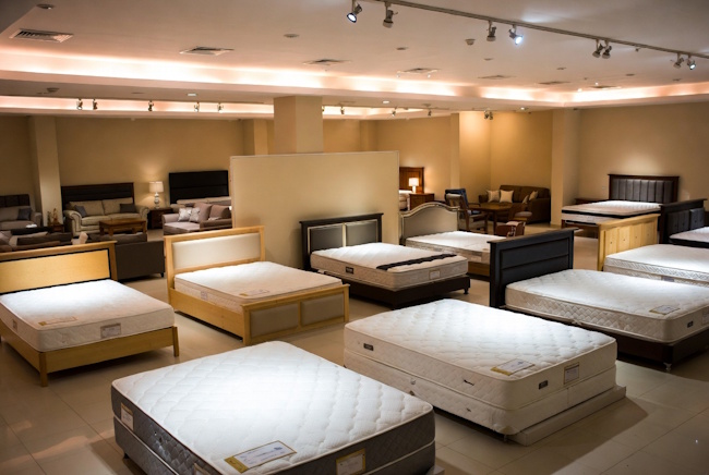 Furniture and mattress showroom with bedroom and living room displays