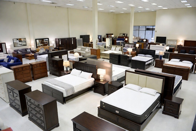 Large furniture showroom with mattresses and bedroom furniture displays