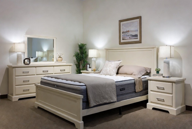 Bedroom furniture package with a mattress, bed frame, dresser, and nightstands