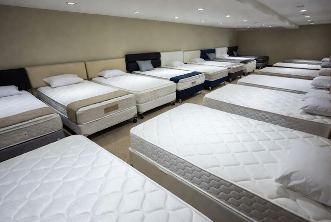 Dedicated mattress showroom with multiple beds for Baton Rouge shoppers